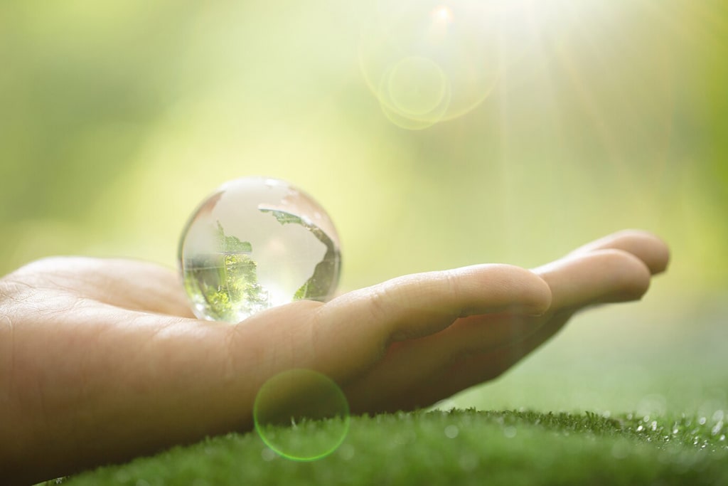 close-up-green-planet-your-hands-save-earth_1150-12732-min
