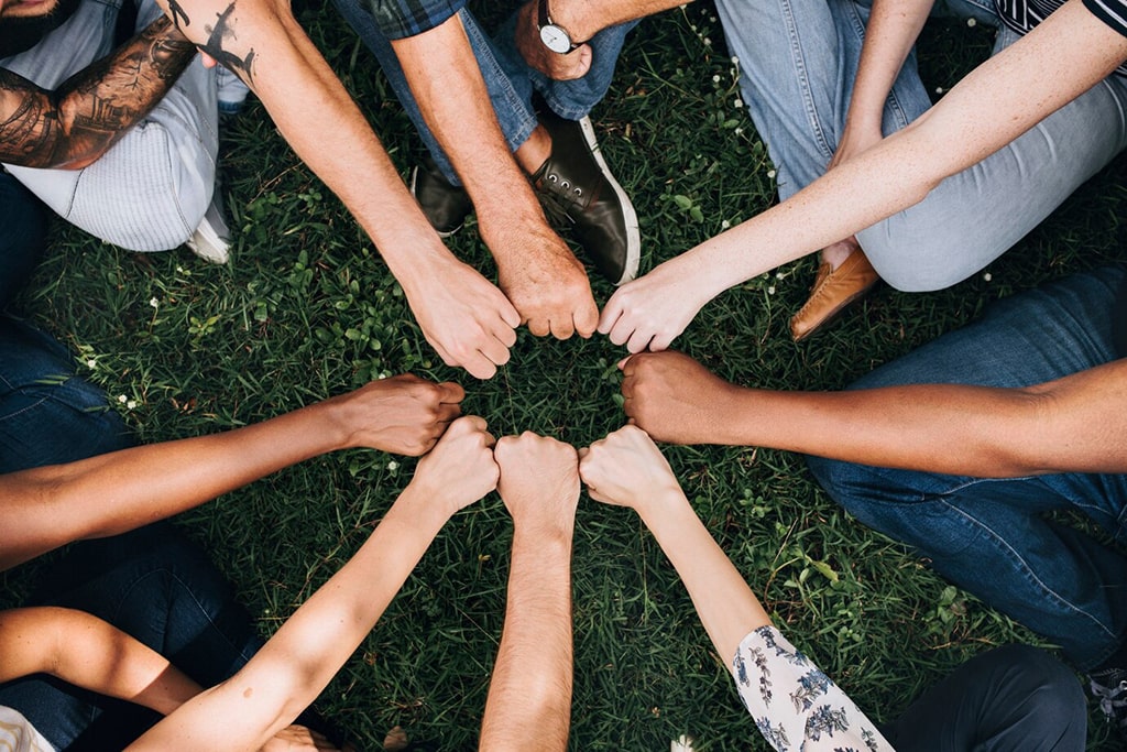 diverse-community-with-hands-circle_53876-105259-min